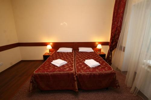 Кровать или кровати в номере На Высоте Отель