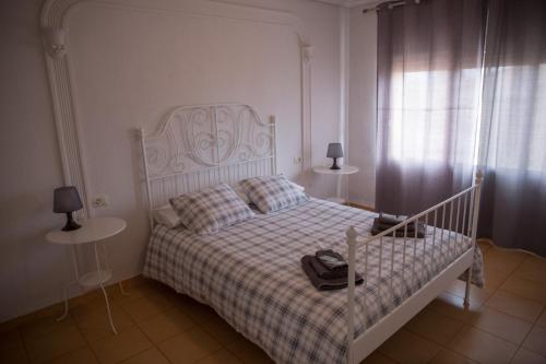 Ένα ή περισσότερα κρεβάτια σε δωμάτιο στο Apartament Casa Neus
