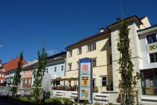a large building with a sign on the side of it at Ferienappartements Oberstbergmeisteramt in Obervellach