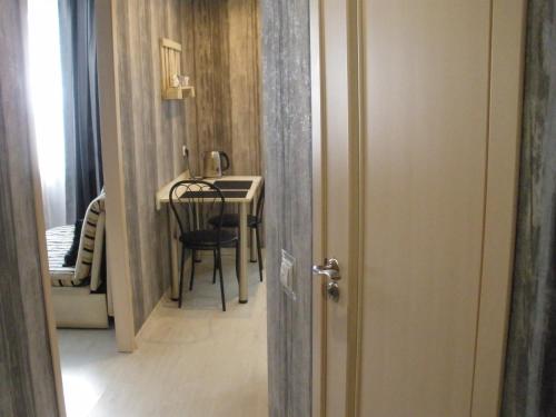 a hallway with a table and a dining room at Apartment квартира Ярослава Мудрого in Kryvyi Rih