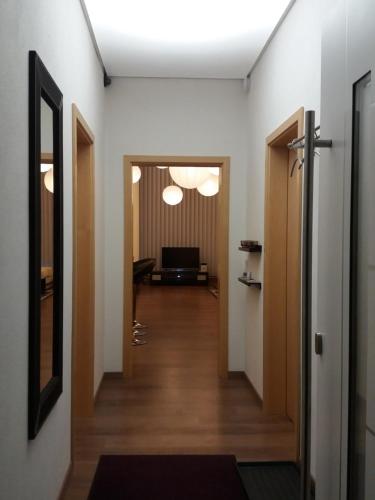 a hallway of an office building with a hallway at Ferienwohnung Schmuckkastl in Tittmoning