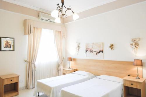 Postel nebo postele na pokoji v ubytování Whitestar Guesthouse