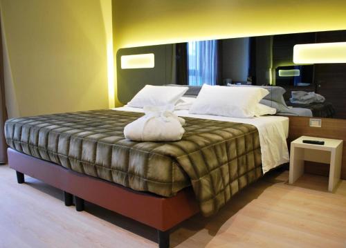 Postel nebo postele na pokoji v ubytování Idea Hotel Plus Savona