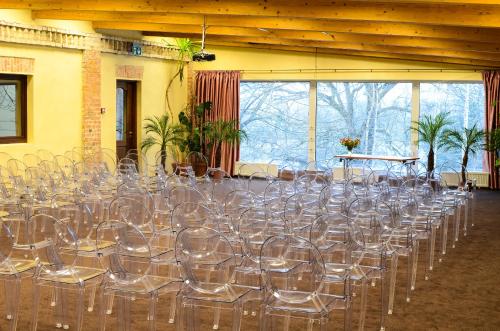 a bunch of empty chairs in a room at Romantic Boutique Hotel & Spa in Panevėžys