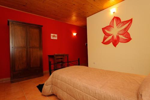 Ένα ή περισσότερα κρεβάτια σε δωμάτιο στο Agriturismo Arcobaleno Assisi