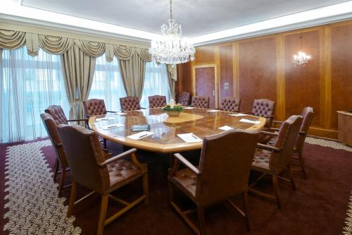 a dining room with a table and chairs at Hotel Devín in Bratislava