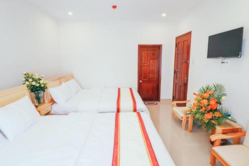 Giường trong phòng chung tại Mai Hoang Da Lat Hotel