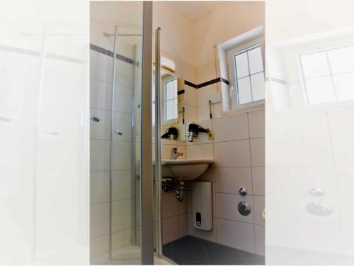 a bathroom with a shower and a sink at Apartment - Direkt am Wasser in Ostseebad Karlshagen