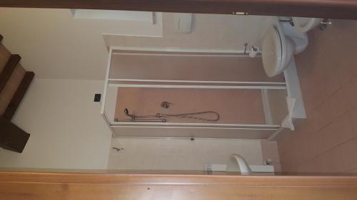 a bathroom with a sink and a pipe on the wall at L'Antico Casale in Perugia