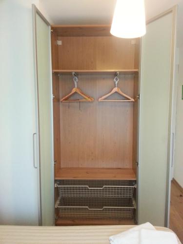 a walk in closet with two hangers at Hostal La Lluna in Arenys de Mar