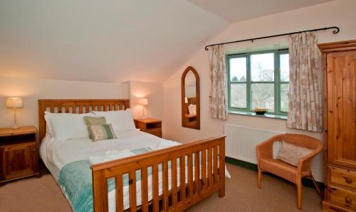 Ένα ή περισσότερα κρεβάτια σε δωμάτιο στο Long Barn Holiday Cottages