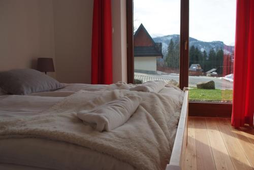 מיטה או מיטות בחדר ב-Zakopanerent