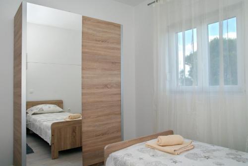 Posteľ alebo postele v izbe v ubytovaní Holiday Home Luka