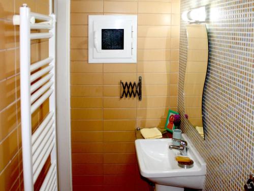 a bathroom with a sink and a mirror at Sweet stone apartment in Imittos in Athens