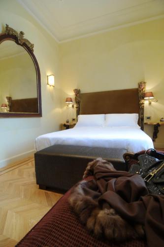 Postel nebo postele na pokoji v ubytování Hotel Villa Duse