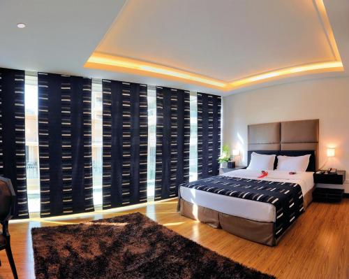 Katil atau katil-katil dalam bilik di Orient Queen Homes Hotel