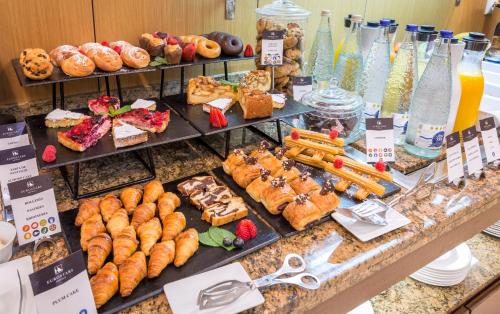 a buffet with many different types of desserts and pastries at Eurostars Monumental in Barcelona
