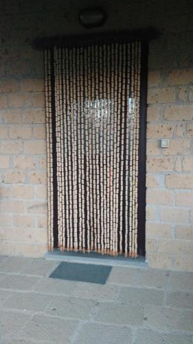 a window with bars on a brick wall at Agriturismo Podernuovo in Acquapendente