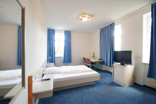 Postel nebo postele na pokoji v ubytování Hotel Neuwirtshaus