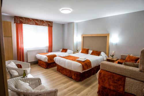Postel nebo postele na pokoji v ubytování Hostal Maribel