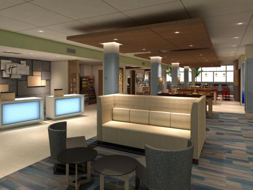 a lobby of a library with tables and chairs at Holiday Inn Express and Suites Des Moines Downtown by IHG in Des Moines