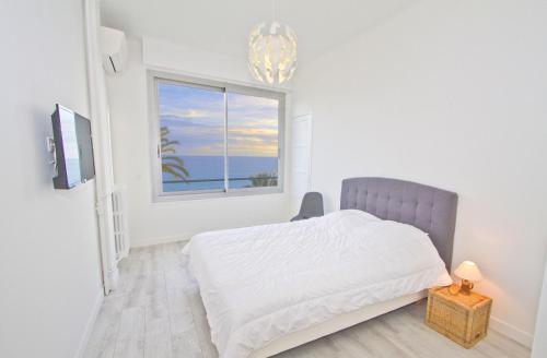 Postel nebo postele na pokoji v ubytování PROMENADE HOLIDAY - AZUR PROMENADE