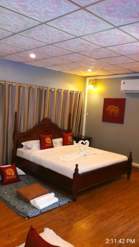 Ένα ή περισσότερα κρεβάτια σε δωμάτιο στο Amantra homestay & village