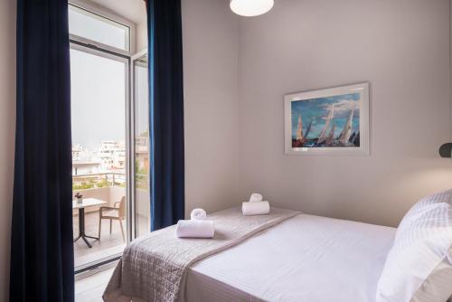 Ένα ή περισσότερα κρεβάτια σε δωμάτιο στο Camara Residence