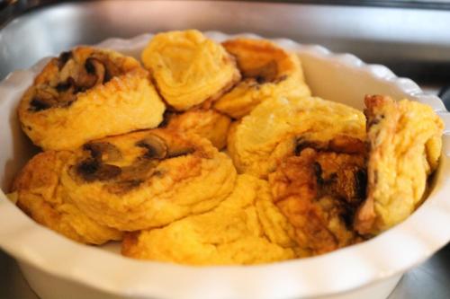 a white bowl filled with muffins and cookies at Castel Transilvania in Baia Mare