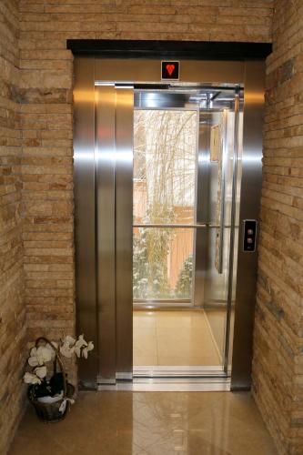 an elevator door in a building with a window at Castel Transilvania in Baia Mare