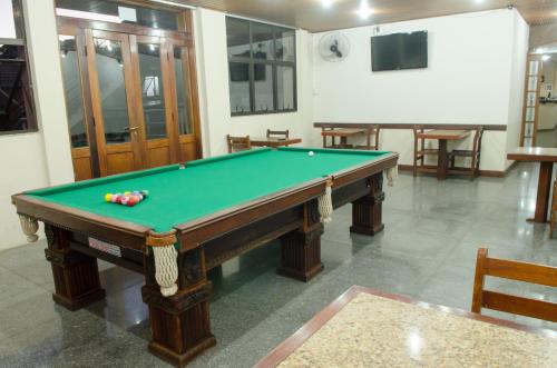 a billiard table in a room with at Samba Betim in Betim
