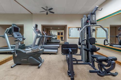 a gym with treadmills and elliptical machines at Hotel AVA Laredo in Laredo