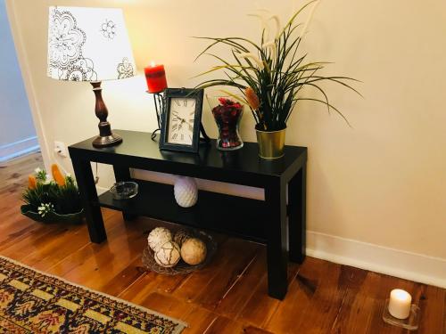 a black table with a lamp and plants on it at Excellent apartment in Lisbon in Lisbon