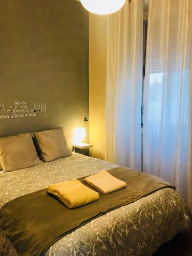 a bedroom with a bed with two towels on it at Excellent apartment in Lisbon in Lisbon