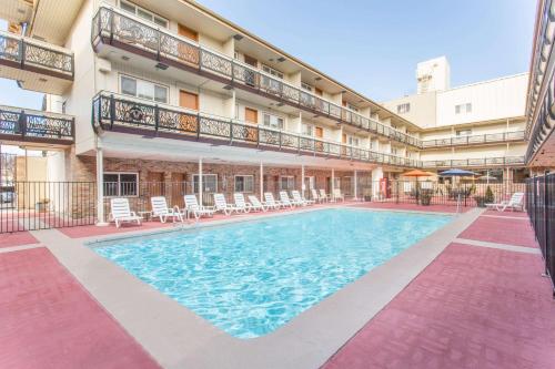 a swimming pool in the courtyard of a hotel at Ramada by Wyndham Elko Hotel at Stockmen's Casino in Elko