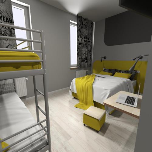 a bedroom with a bunk bed and a laptop on a table at La Guitarra Hostel Poznań in Poznań