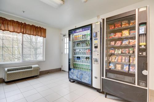 a large refrigerator in a room with food at Studio 6-Mountlake Terrace, WA - Seattle in Mountlake Terrace