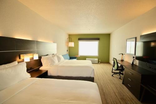 a hotel room with two beds and a desk at Holiday Inn Express & Suites - Kirksville - University Area, an IHG Hotel in Kirksville