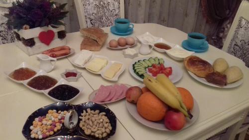 a table with many different types of food on it at House in Quba in Quba