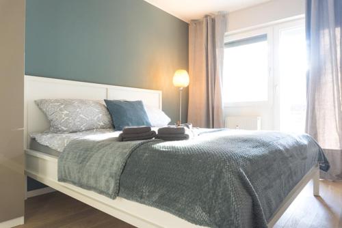 Un pat sau paturi într-o cameră la KUKU Urban & Family Appartement