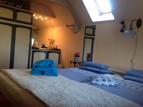 Katil atau katil-katil dalam bilik di B&B Buitenwaard