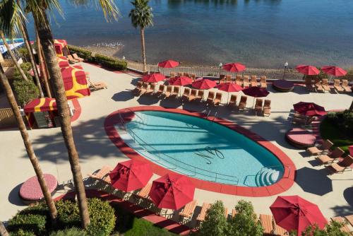 an overhead view of a pool with umbrellas and the beach at Golden Nugget Laughlin in Laughlin