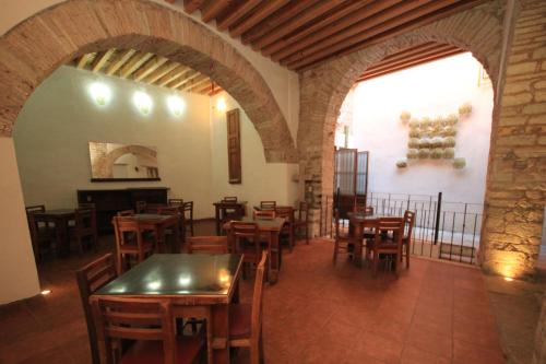 a dining room with tables and chairs in a building at Hotel Boutique Ponciano in Guanajuato