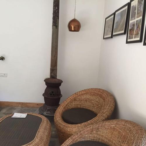 a bathroom with a wicker toilet in a room at Samira's Birds & Butterflies Park-Spashram Ganga Beach Retreat in Rishīkesh