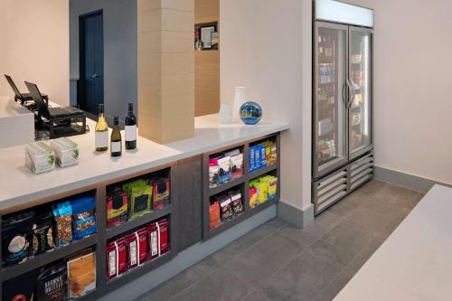 a wine cellar with a counter with wine bottles at Hyatt House Irvine/John Wayne Airport in Irvine
