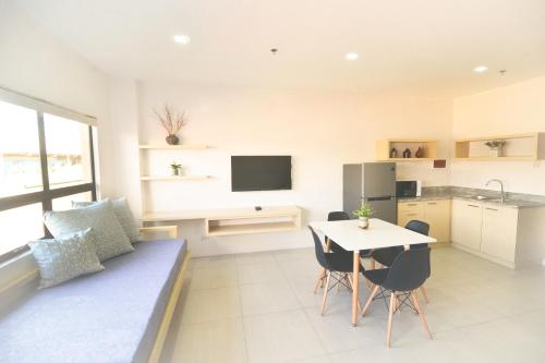 a living room with a couch and a table at Felix Residences in Cebu City