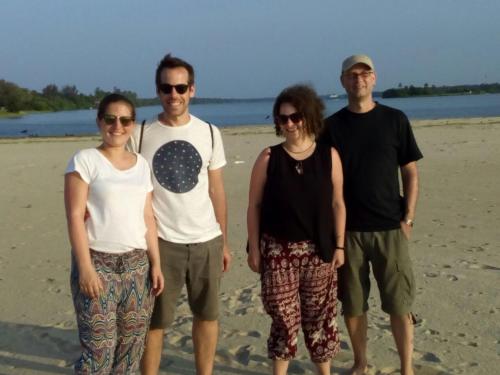 a group of people standing on the beach at Naaval Beach Villa & Rooms in Batticaloa