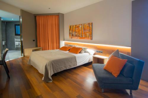 Giường trong phòng chung tại Hotel America Igualada