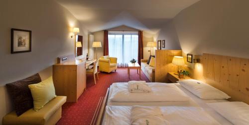 Postel nebo postele na pokoji v ubytování Hotel St. Anton