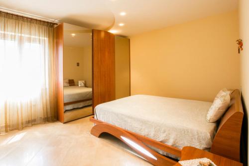 מיטה או מיטות בחדר ב-Albatros Sorrento